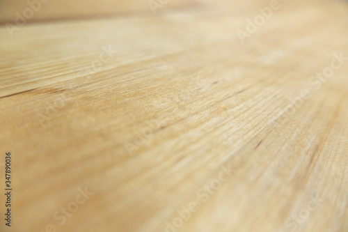 Wood texture, wooden background in perspective closeup with shallow depth of field.
