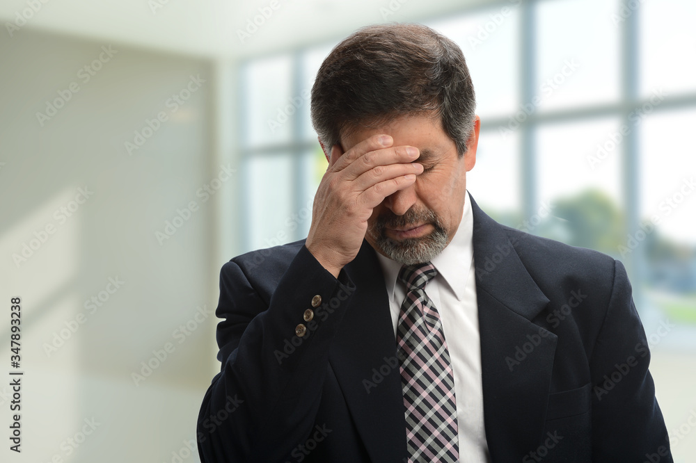 Mature businesman under  stress