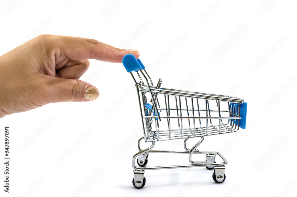 Fototapeta premium hand pushing a small shopping cart on a white background