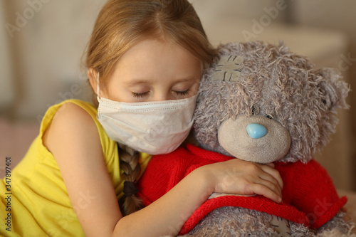 little girl with a teddy bear