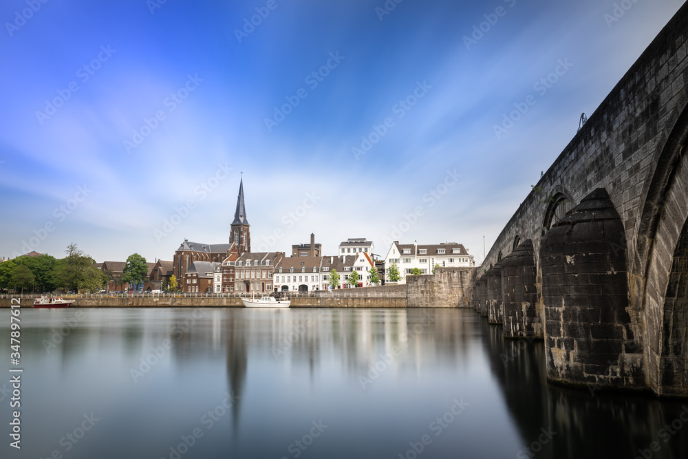Maastricht, Limburg. Long exposure of the skyline of Maastricht, the Netherlands. With the medieval Sint Servaas bridge and the Sint Augustinus church. 