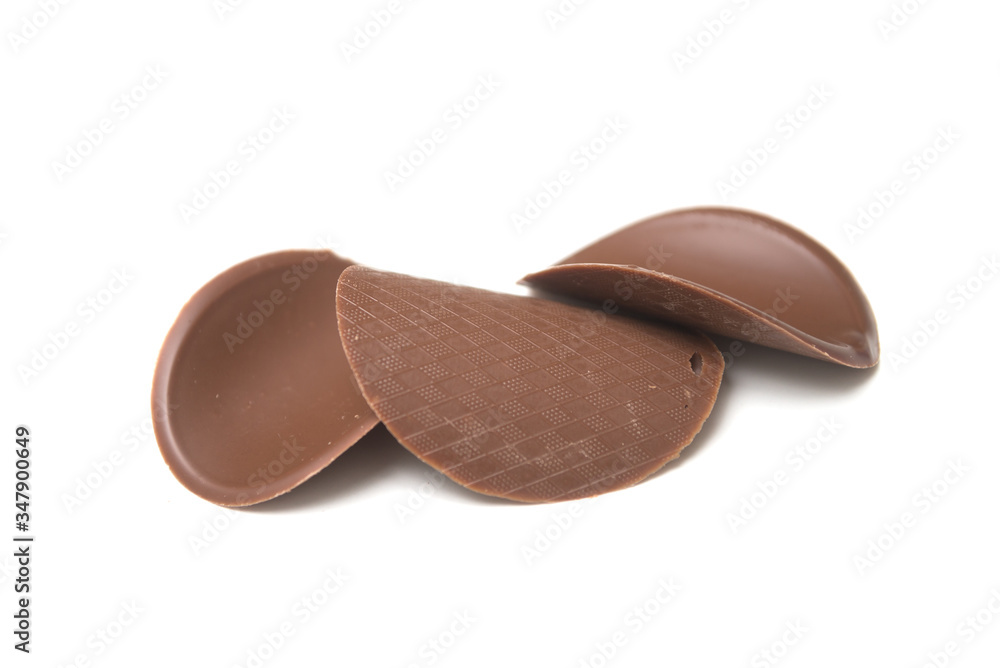 Closeup of chocolate in shaped tiles on white background Closeup of chocolate in shaped tiles on white background