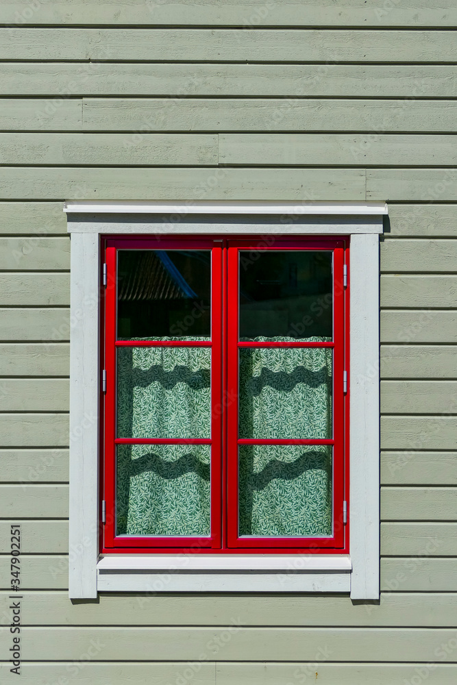 Soderkoping, Sweden A finely painted window and facade of a wooden house.