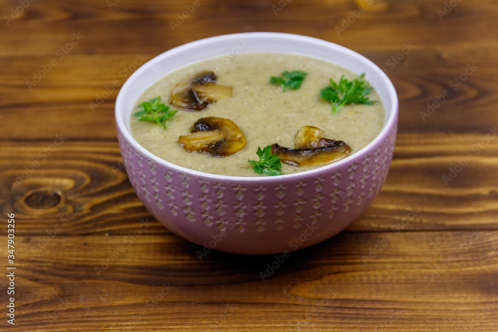 Mushroom cream soup on a wooden table Mushroom cream soup on a wooden table