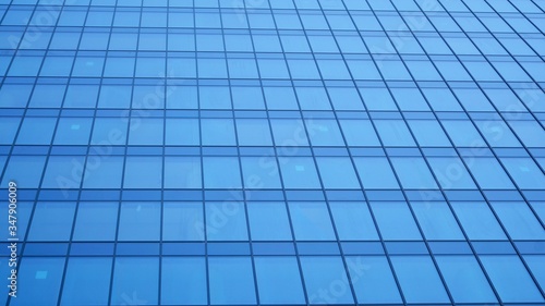 Modern architecture. Glass facade on the blue sky. Corporate concept - detail of modern glass building.