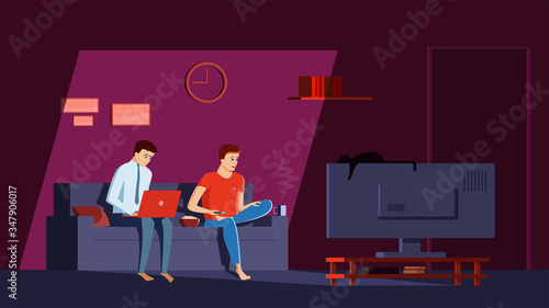 Men spend time at home on isolation. A man sits in his apartment on sofa with legs crossed, surprised expression on his face, watching news on TV. Businessman working on a laptop in a work suit.