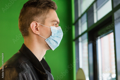 Young man in medical mask. quarantine security. Man in the shop
