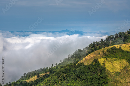 Sea of mist  mountains above the clouds with green forests and mountains ridge and mountains peak. Beautiful in nature landscape  Mae Moei national park  Tak province  Thailand. 
