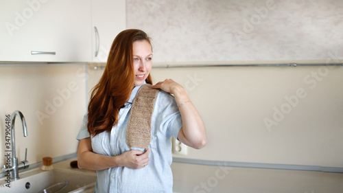 Caucasian woman with natural jute body washcloth