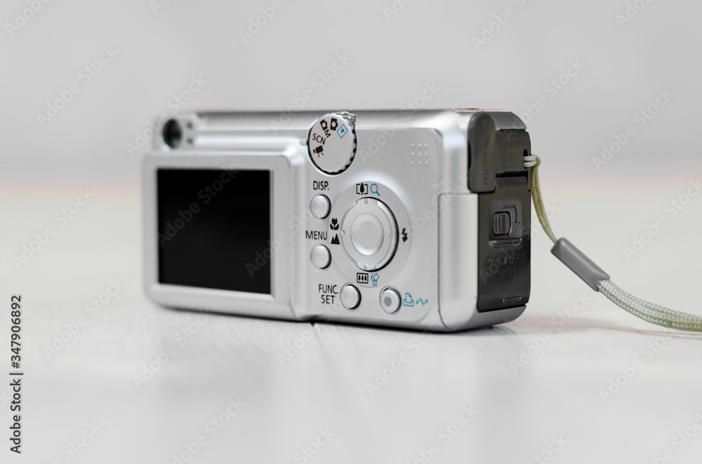 Old digital camera. The small camera is silver.