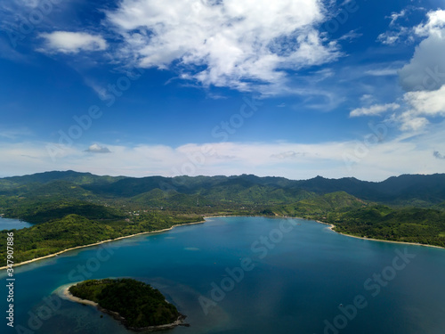 Lombok, Indonesia, south Gili islands. Aerial drone view from the Gili Asahan island to the sea and the highlands of Lombok.