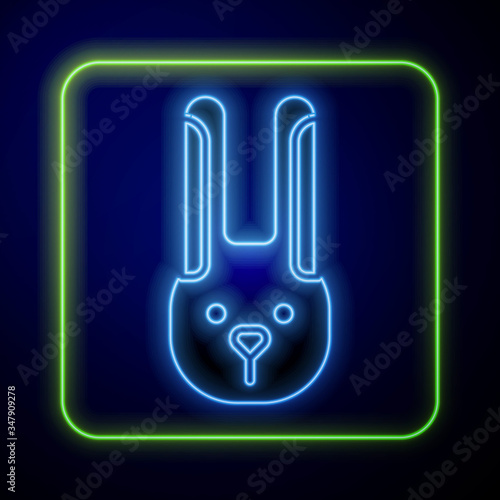 Glowing neon Rabbit with ears icon isolated on blue background. Magic trick. Mystery entertainment concept