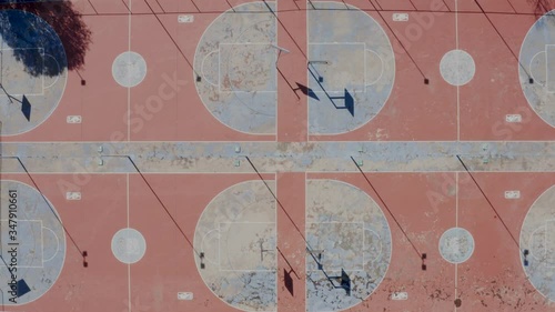 Top view of empty, rundown basketball courts in Alexandra Township, South Africa during the covid-19 coronavirus lockdown. 