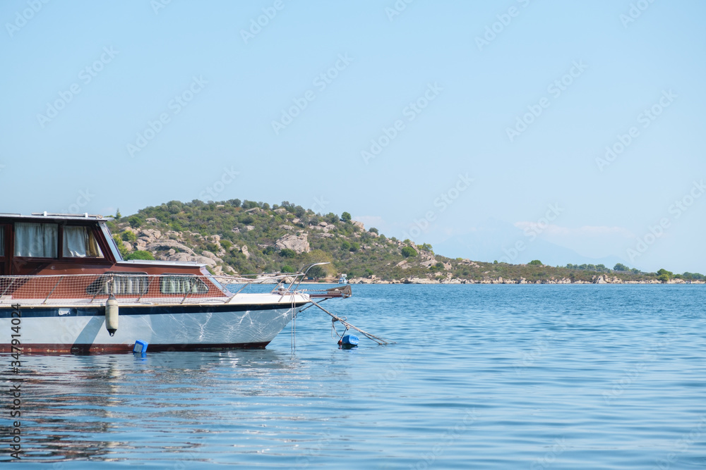 Half boat on the left side in the water with copy space Half boat on the left side in the water with copy space