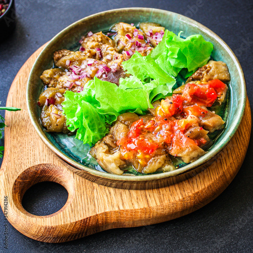 eggplant salad spices and tomatoes, antipasto Menu concept healthy eating. food background top view copy space for text keto or paleo organic product diet
healthy eating