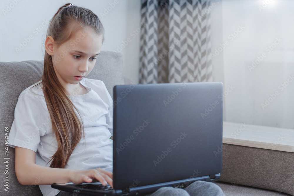 Distance learning online education. School girl studying at home with digital tablet laptop notebook Distance learning online education. School girl studying at home with digital tablet laptop notebook