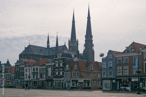 Detail of medieval skyline with towers churches in historic city center of Delft, Netherlands. Travel or tourist abstract cityscape. 