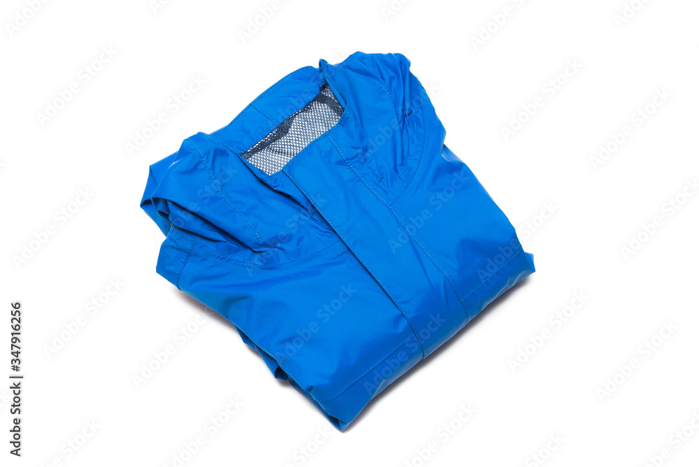 Folded blue zipper windbreaker jacket, rain proof and waterproof hiking Gore-Tex jacket hoodie. Track jacket sport nylon full zip isolated on white. Folded clothes. Outer layer garment for travel. Folded blue zipper windbreaker jacket, rain proof and waterproof hiking Gore-Tex jacket hoodie. Track jacket sport nylon full zip isolated on white. Folded clothes. Outer layer garment for travel.