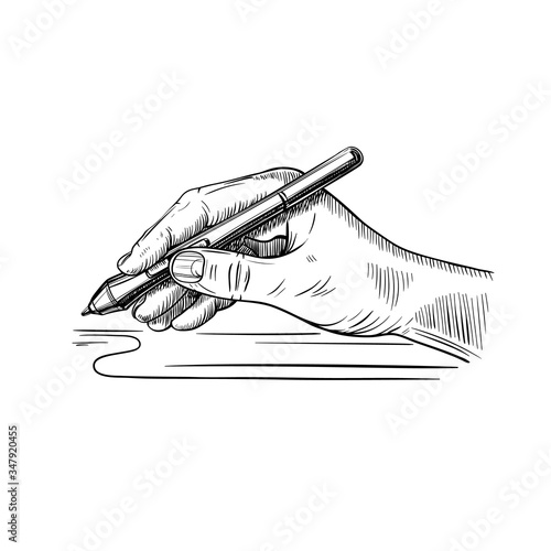 hand holds the stylus for drawing on the graphic tablet