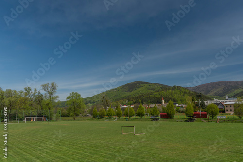 Dolni Becva village in spring color fresh green day with church and meadows