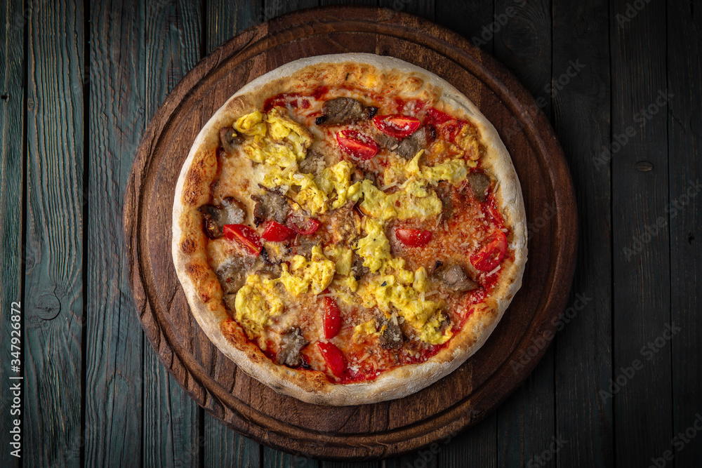 Tasty hot italian pizza with with egg, pork and tomatoes. Pizzeria menu. Concept poster for Restaurants or pizzerias Tasty hot italian pizza with with egg, pork and tomatoes. Pizzeria menu. Concept poster for Restaurants or pizzerias