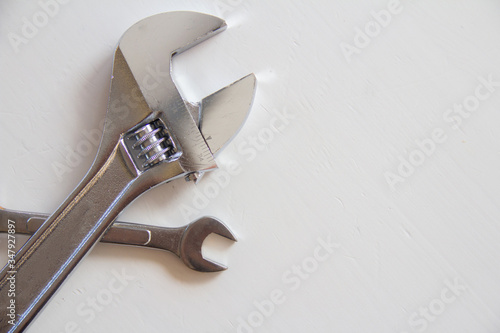 Male tools. Mechanic hand hold spanner tool. Happy Father's Day inscription with on white background. Greetings and presents. white card with the ability to insert text, copyspace, 