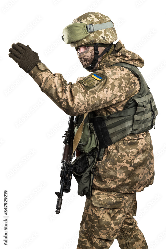 Ukraine officer in mechanized infantry uniform isolated with clipping path on white background. (Flag and arms of Ukraine on the shoulder. Patch on the chest with the inscription Ukraine in Ukrainian) Ukraine officer in mechanized infantry uniform isolated with clipping path on white background. (Flag and arms of Ukraine on the shoulder. Patch on the chest with the inscription Ukraine in Ukrainian)