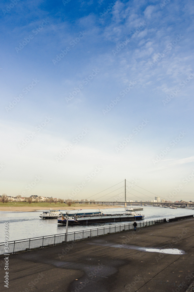 River barge in Dusseldorf, view from the shore, late autumn, early winter, Germany