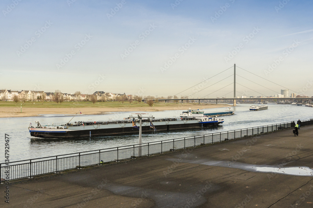 River barge in Dusseldorf, view from the shore, late autumn, early winter, Germany
