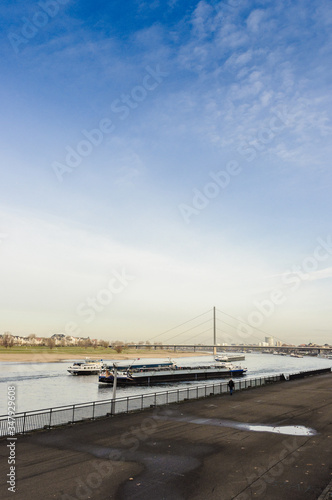 River barge in Dusseldorf, view from the shore, late autumn, early winter, Germany © yemets