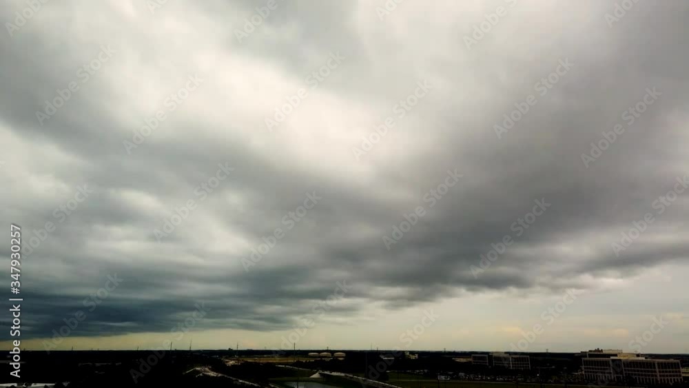 Timelapse of storm clouds moving and rolling quickly trough the sky in Orlando, USA. Concept or dark stormy times are coming. Timelapse of storm clouds moving and rolling quickly trough the sky in Orlando, USA. Concept or dark stormy times are coming.