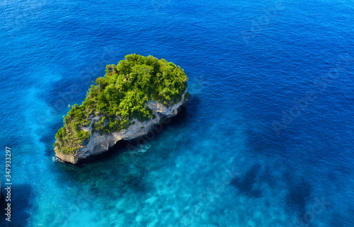 Aerial view at sea and rocks. Blue water background from top view. Summer seascape from air. Atuh beach, Nusa Penida, Bali, Indonesia. Travel - image