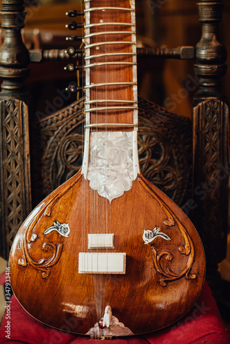 Close up photo of a sitar, traditional Indian musical instrument photo