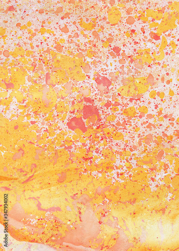Abstract background, monotype, hand painted texture. Marble abstract background yellow and red shades. Nature marbling artwork texture.