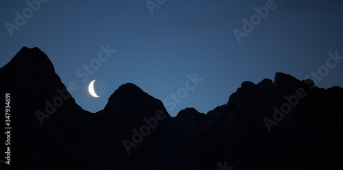 moonrise over mountain range in Greenland photo