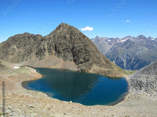View of the Schwarzsee in the �tztal alps over S�lden in Tirol Austria. The view is from the trak to the summit of Schwarzkogel photo