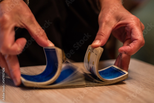 hands holding playing cards