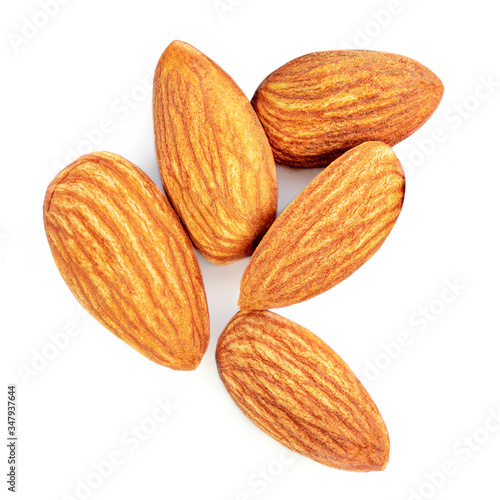 Almonds isolated. Raw Almond nuts on white background. Top view. Flat lay