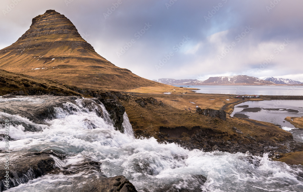 Kirkjufell mountain and kirkjufellfoss waterfall at grundarfjordur in Iceland