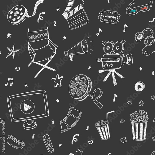 Seamless pattern with hand drawn cinema doodles on a chalkboard background