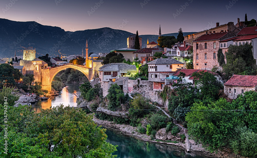 Fototapeta premium Colorful sunset over the medieval bridge of Mostar on 11 August, 2019.