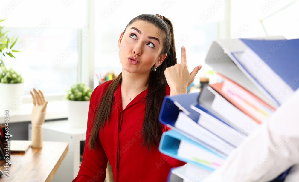 Girl is unhappy with number folders man carries