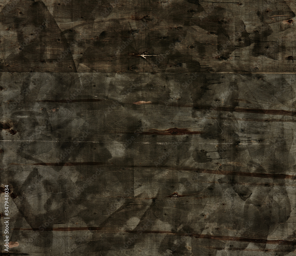 abstract black painting on a wood background, painting in grunge style, dark painting on a plywood