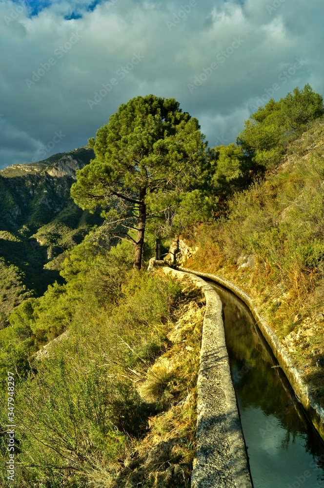 traditional acequía irrigation ditch in the mountains Andalusia above Río Chillar traditional acequía irrigation ditch in the mountains Andalusia above Río Chillar