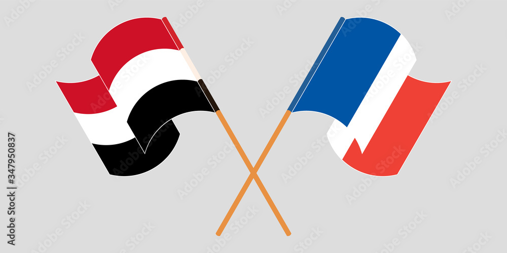 Crossed and waving flags of Yemen and France Crossed and waving flags of Yemen and France