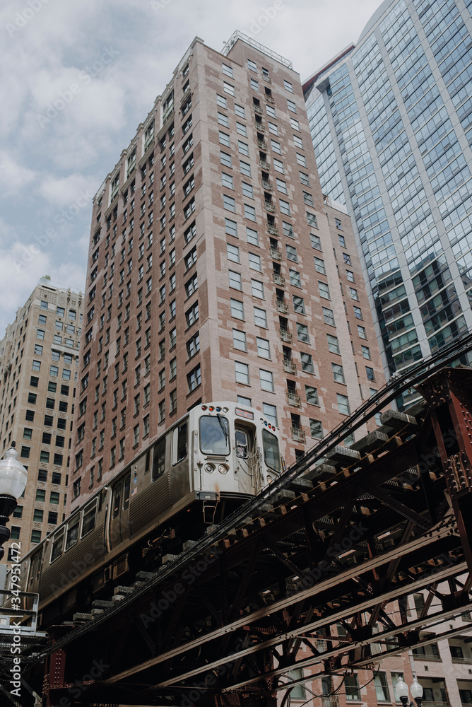 Train on elevated road near modern buildings Train on elevated road near modern buildings