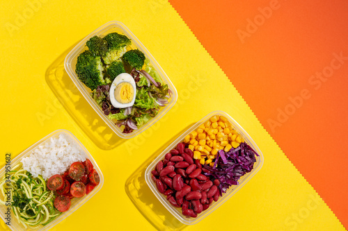 Homemade vegan food in lunch boxes with healthy vegetable fresh from above. Vegan food concept. Healthy food. Flat lay. Top view