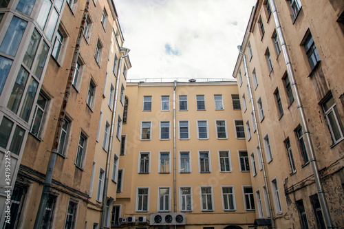 View of the courtyard of the yellow house. Wells St. Petersburg at home.Windows of a big city. © Алексей Васильев