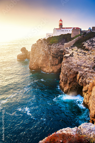 Lighthouse on Cape St. Vincent at sunset in Algarve, Portugal. Summer landscape.This is the most South-Western point of Europe photo