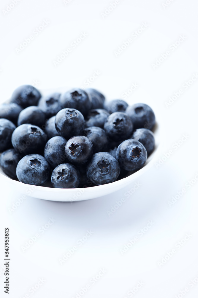 Bilberries isolated on white background. Concept for healthy nutrition. Copy space. Bilberries isolated on white background. Concept for healthy nutrition. Copy space.